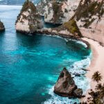 A breathtaking view of Nusa Penida's turquoise waters and rocky cliffs in Bali, Indonesia.