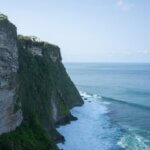 Breathtaking view of Uluwatu Cliffs meeting the Indian Ocean in Bali, Indonesia.
